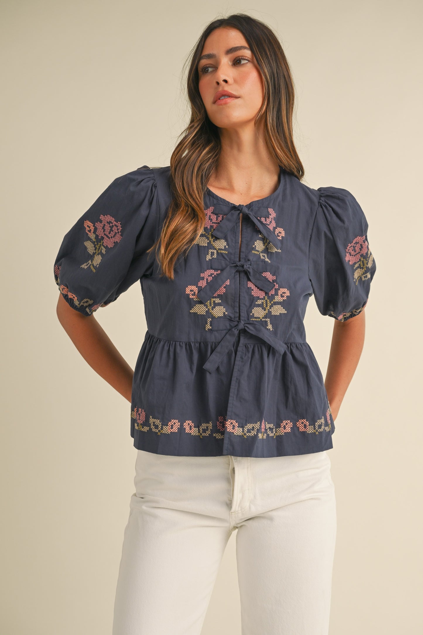 The Roslyn Embroidered puff Sleeve Front Tie Peplum Top Navy
